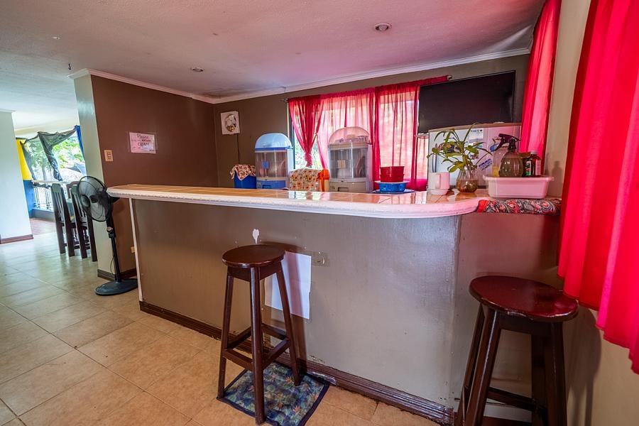Refreshment counter with water dispensers at Pecan Pension House